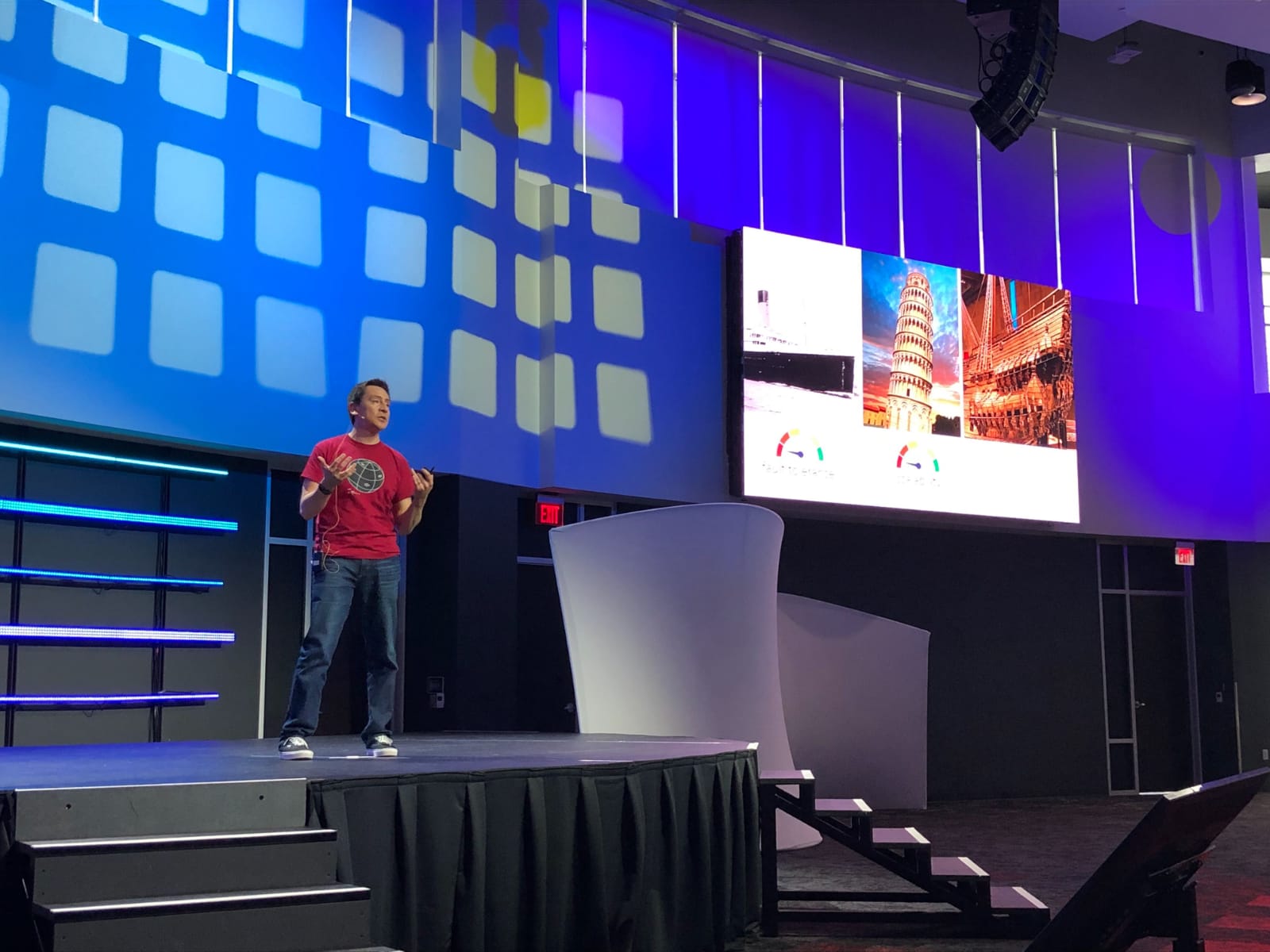 Orlando speaking on stage at a conference